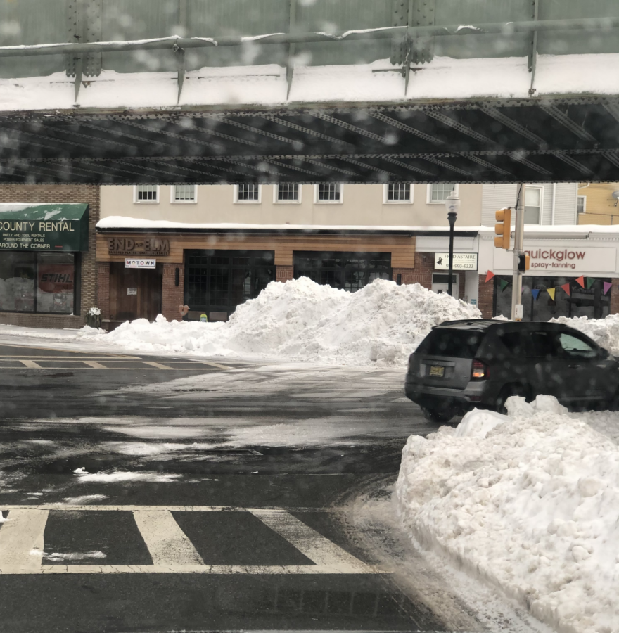 After 2 days of consistent snowfall (totaling 19 inches), snowbanks loomed over sidewalks in Morristown on February 3, 2021.  