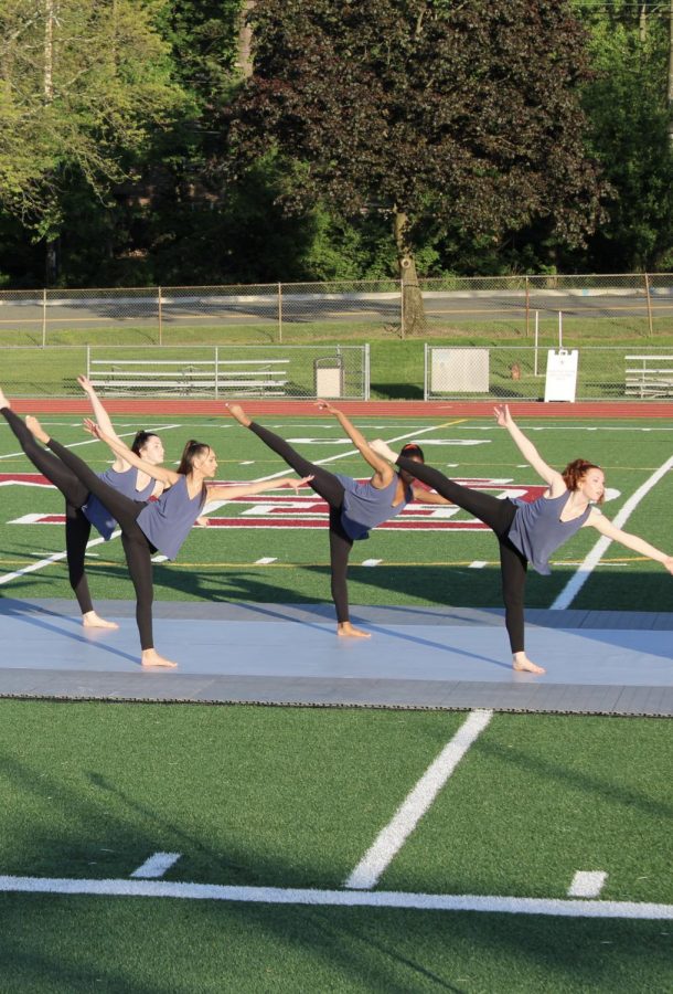 The MBS Dance Ensemble performs together on Burke Field.
