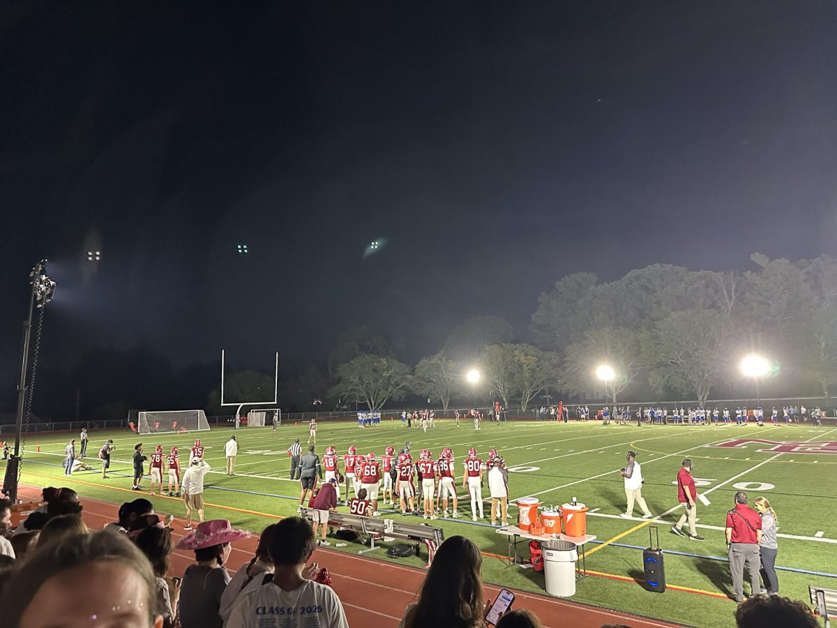 The Crimson football team gets ready for another play.